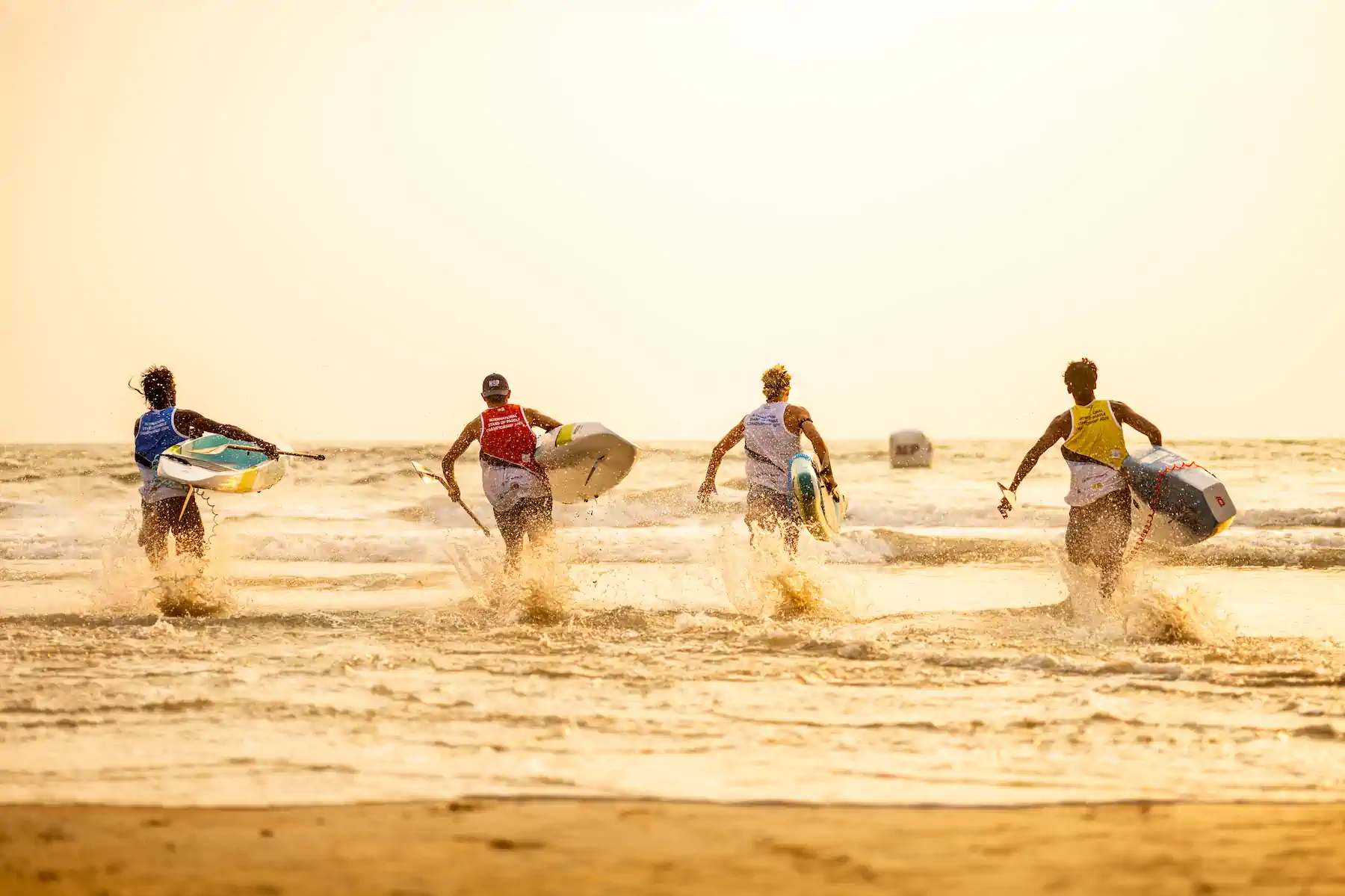 Stand Up Paddling athletes racing on open water