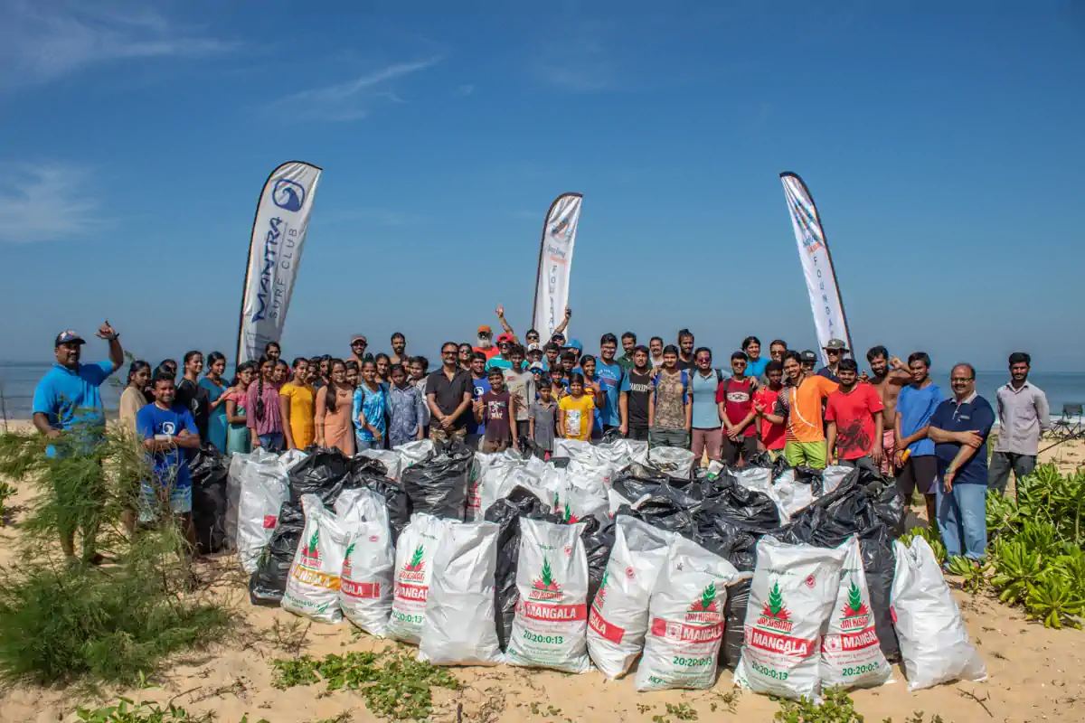 Volunteers working together on a beach